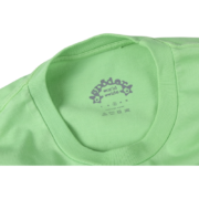 Close-up view of the branded neck tag on the vibrant slime green Sp5der Worldwide streetwear t-shirt.