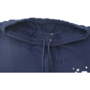 Close-up of the elasticated waistband and drawstring detail on the blue Sp5der Arach NY Phobia streetwear sweatpants.