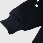 Black Sp5der Jeffery hoodie close-up detail showcasing the high-quality ribbed cuff and premium cotton fabric texture.