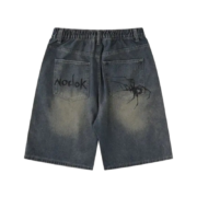 Back view of Sp5der print denim shorts featuring a dark wash, elastic waistband, and unique graphic spider designs.
