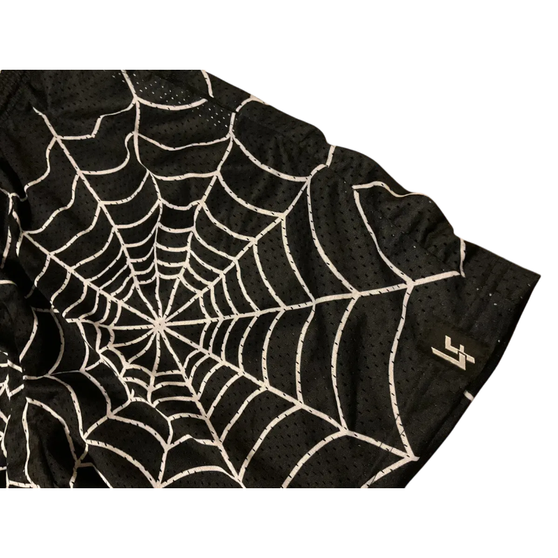 Close-up detail of the black mesh Lost Files Sp5der Web Short featuring an iconic white spider web graphic design.