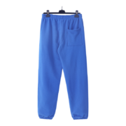 Back view of the premium Sp5der Websuit royal blue sweatpants with an elasticated waistband and comfortable loose fit.