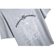 Grey Sp5der Arach Phobia New York graphic t-shirt featuring a white spider web design for an urban streetwear look.
