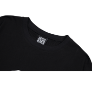 Close-up of the Sp5der Reunion 555 T-shirt neck label showing premium branding and construction details.