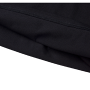 Close up view of the durable stitching and premium heavyweight black cotton fabric on the Sp5der The Spot Tee.