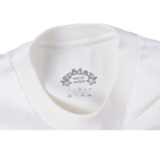 Close up view of the SP5DER World Wide branded neck label inside a premium cotton streetwear t-shirt.