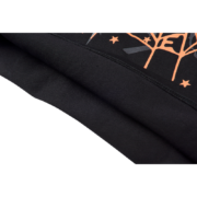 Detail shot of the premium black fabric and graphic design on the SP5DER x Cactus Jack x ComplexCon exclusive tee.