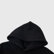 Close-up detail of the black Sp5der Atlanta star-print hoodie showcasing the oversized hood construction