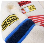 Detail view of the Sp5der Wor1dwide 555555 Hunters Sherpa Jacket featuring colorful embroidered patch designs.