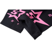 Close-up view of the Sp5der 5Star Vintage 501 Denim in Black featuring iconic pink star print graphic detailing.