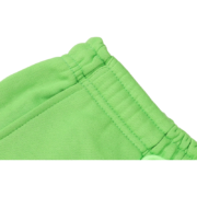 Close up of the elasticated waistband on the green Sp5der Websuit sweatpants, highlighting the premium fabric quality.