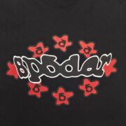 Front view of the black Sp5der Warped T-shirt featuring a distorted graphic logo design and red star accents.