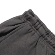 Close-up view of the elasticated waistband detail on the premium Sp5der Beluga Sweatpant in Jet-Black colorway.