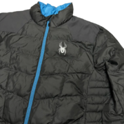 Sp5der men’s light down puffer jacket featuring a sleek black design with blue zipper details and logo branding.