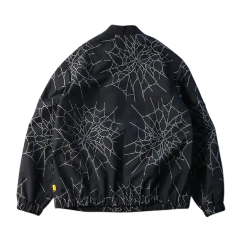 Back view of the Sp5der Number Nine jacket featuring an all-over intricate spiderweb graphic design in streetwear style.