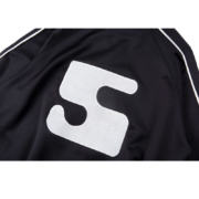 Close-up view of the white SP5DER logo detail on a sleek black SP5DER G550 high-performance outerwear jacket.