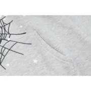Close up shot of the gray fabric texture on the Sp5der I Heart SP5 souvenir hoodie featuring web and star graphic