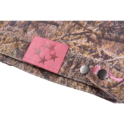 Sp5der Trucker Jacket in Real Tree Camo featuring a detailed pink brand patch and metallic button closures on fabric.