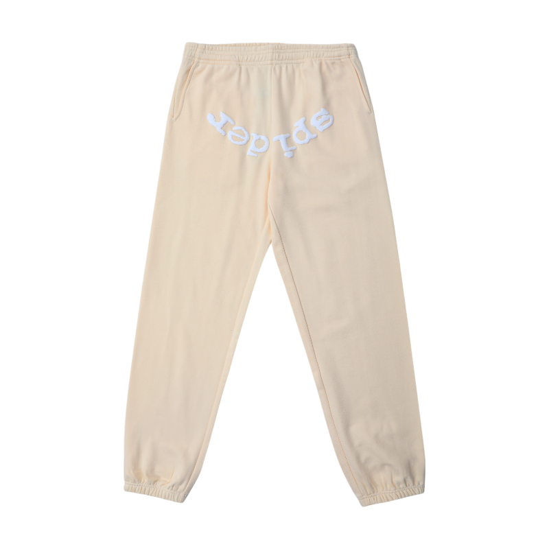 Cream Sp5der OG Tree Camo sweatpants featuring iconic branding and a comfortable loose fit, perfect for urban wear.