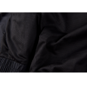 Close-up view of the premium black mesh lining detail on the Sp5der Pro windbreaker jacket fabric.