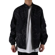 Front view of the black Sp5der Number Nine jacket featuring a unique web-like graphic pattern and modern streetwear fit.