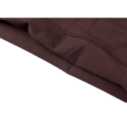 High-quality brown fabric detail of the Sp5der Sp5 Sex Tee showing premium craftsmanship and soft material texture.