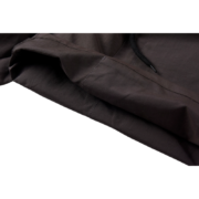 Close-up view of the black Sp5der shorts fabric featuring an embroidered logo and high-performance material design.