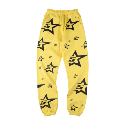 Front view of the vibrant yellow Sp5der 5Star sweatpants featuring a black star logo pattern throughout the design.