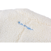 Close-up view of the white sherpa material featuring the blue Sp5der wor1dwide 555555 Hunters jacket embroidery detail.