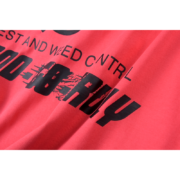 Close-up view of the Sp5der Bite Tee in red featuring bold black graphic print detail and high-quality cotton fabric.