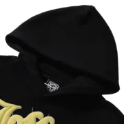 Close up detail of the premium black Sp5der Jeffery Hoodie featuring the iconic brand logo and quality fabric design.