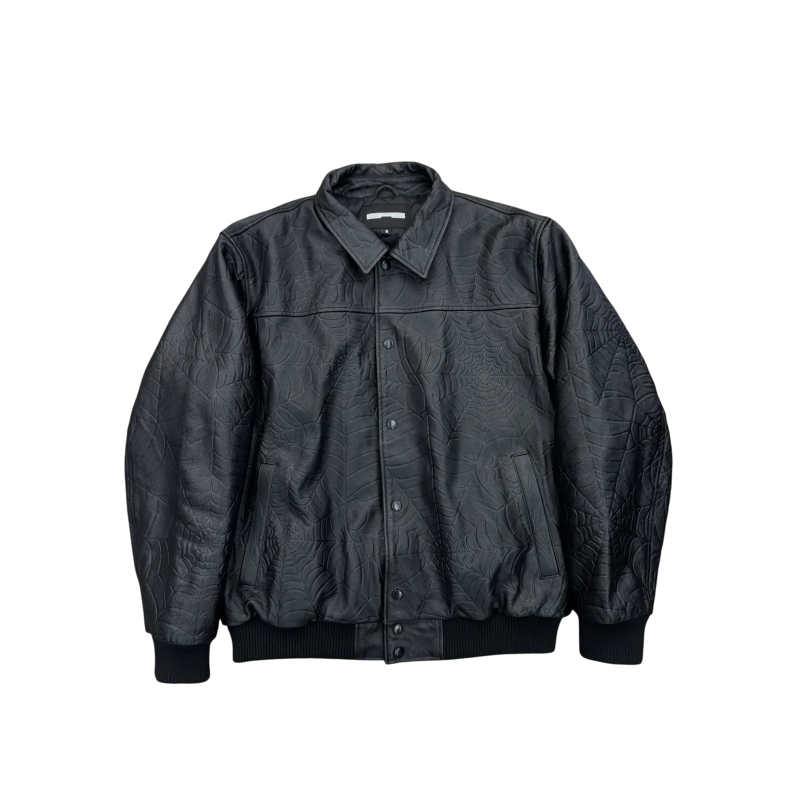 Front view of the SP5DER Debossed Web Studded Leather Jacket featuring a textured spider web pattern in black leather.
