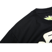 Shoulder close-up of the black Sp5der Worldwide Star Beluga T-shirt featuring a celestial star graphic design.