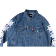 Front view of the premium SP5DER Worldwide denim jacket featuring signature white graphic detailing on the sleeves.