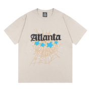 Sp5der Young Thug Atlanta graphic t-shirt featuring a spiderweb design and blue stars on a light-colored cotton tee.