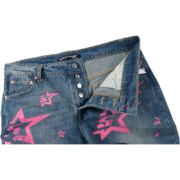 Sp5der 5Star Vintage 501 Denim jeans in blue with pink star prints, featuring a button fly and buttoned waist.