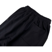 Black Sp5der Souvenir SP5 sweatpants showcasing a comfortable elasticated waistband and durable fabric construction.