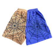 Front view of the Sp5der Lost Files split-design basketball shorts featuring a unique two-tone color web graphic.