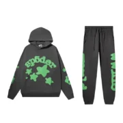 A Sp5der Beluga hoodie and matching jet-black tracksuit set with vibrant green star graphics and text details.