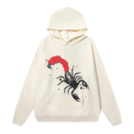 Sp5der x Mariah the Scientist Scorpion Hoodie in cream with a graphic print featuring a black and red scorpion design.