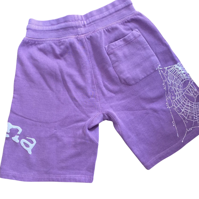 Back view of purple Sp5der Worldwide Wunna shorts featuring a white spider web graphic and premium streetwear design.