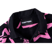 Close-up view of the Sp5der 5 Star Trucker Jacket featuring the internal brand label and pink star pattern on black.