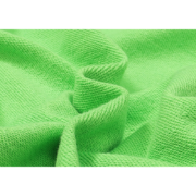Close-up view of the high-quality green fabric texture used for the Sp5der Websuit sweatpants product design.