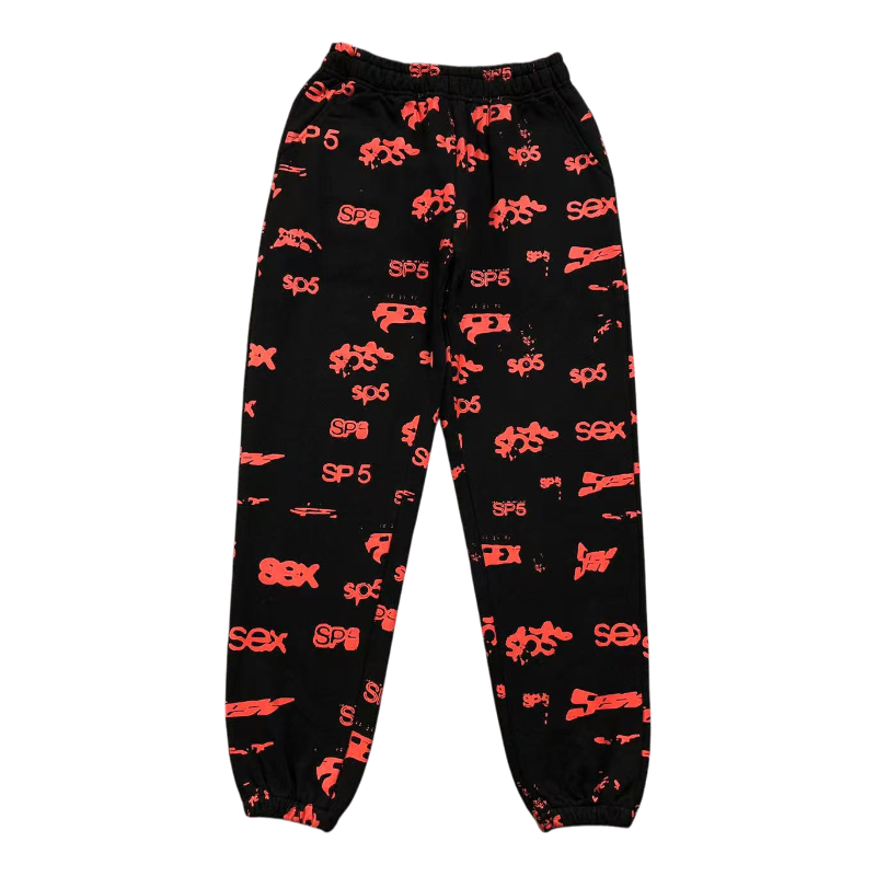 Front view of black Sp5der Sex AOP sweatpants with red all-over print logo and streetwear design aesthetic.