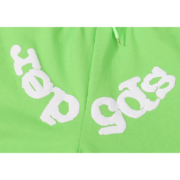 Green Sp5der Websuit sweatpants featuring the signature distressed white logo print in a close-up product detail view.