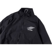 Close-up of the black Sp5der Pro windbreaker jacket showing the front logo detail and full-length front zipper.