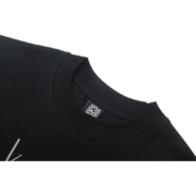 Close-up view of the black Sp5der Atlanta print t-shirt showing the internal brand neck label detail on the collar.