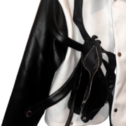 A close-up of the premium Roam The Halls Sp5der jacket, highlighting the sleek black and white streetwear design.