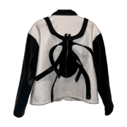 Back view of the black and white Roam The Halls Sp5der jacket featuring a bold, distinctive spider-shaped graphic.