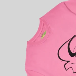 Close up of the Sp5der Pink Bite Tee showing the vibrant pink fabric and black graphic details on the front of the shirt